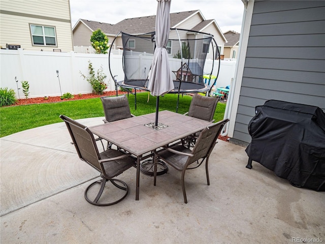 8809 15th Street Rd, Greeley, CO 80634 - view of patio / terrace with a trampoline and outdoor dining area