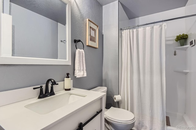 bathroom with vanity, toilet, and a shower with shower curtain