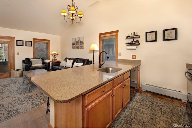 91 River Run Rd Unit 8140, Keystone, CO 80435 - kitchen featuring a sink, a baseboard radiator, open floor plan, a chandelier, and high vaulted ceiling