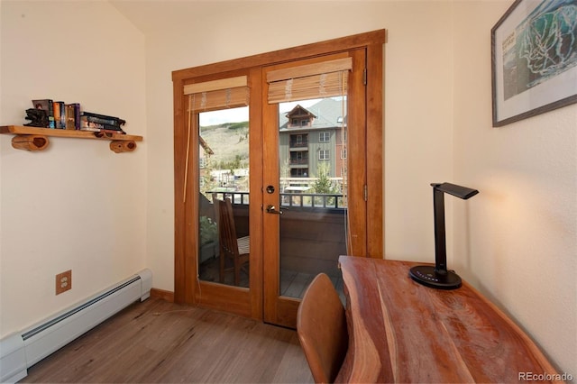 91 River Run Rd Unit 8140, Keystone, CO 80435 - entryway featuring a baseboard heating unit, wood finished floors, french doors, and baseboards