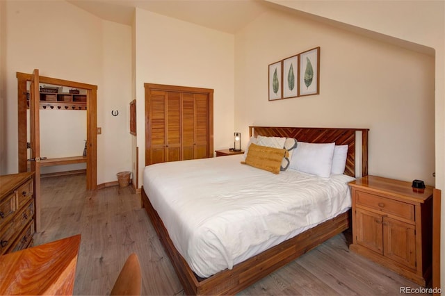 91 River Run Rd Unit 8140, Keystone, CO 80435 - bedroom with light wood-type flooring, a closet, and high vaulted ceiling