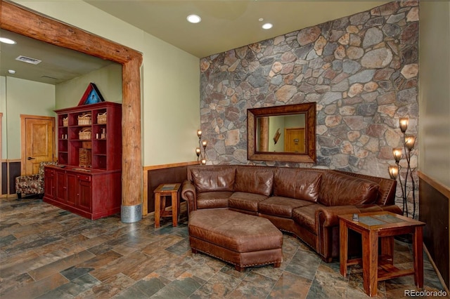 91 River Run Rd Unit 8140, Keystone, CO 80435 - living room with stone finish floors, a wainscoted wall, and recessed lighting