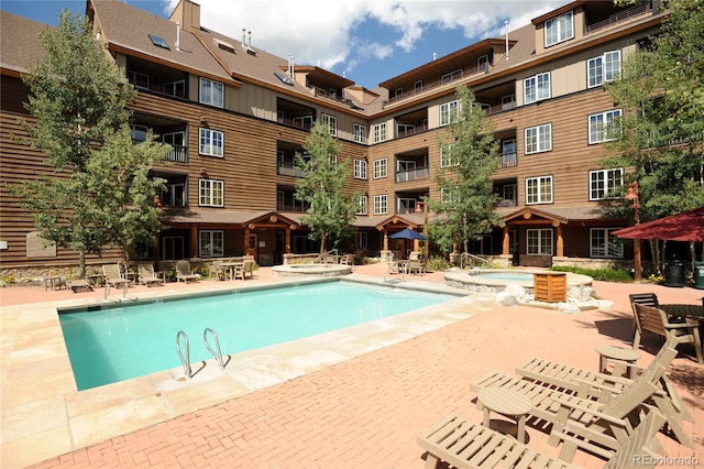 91 River Run Rd Unit 8140, Keystone, CO 80435 - community pool featuring a hot tub and a patio