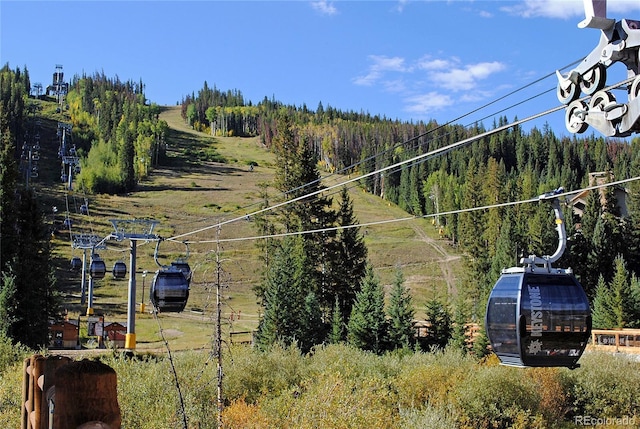 91 River Run Rd Unit 8140, Keystone, CO 80435 - view of yard with a wooded view, an outdoor structure, and a greenhouse