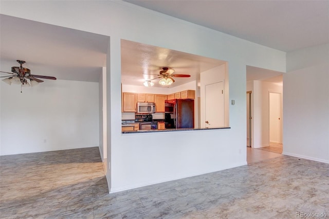 kitchen with black fridge, ceiling fan, light brown cabinets, and range with electric stovetop