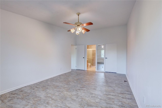 unfurnished room with lofted ceiling and ceiling fan