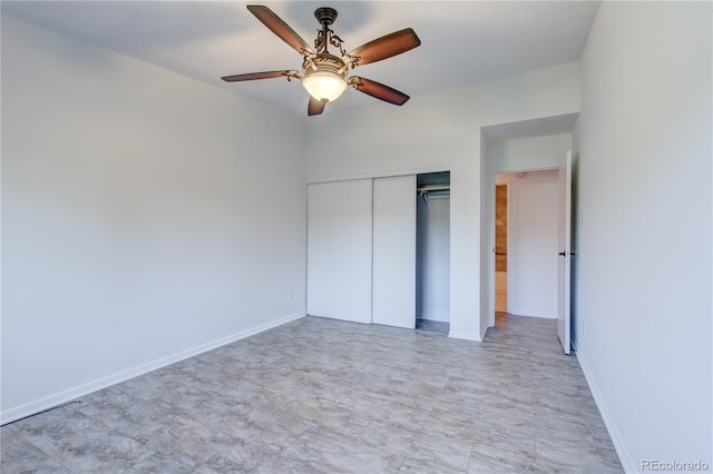 unfurnished bedroom with ceiling fan and a closet