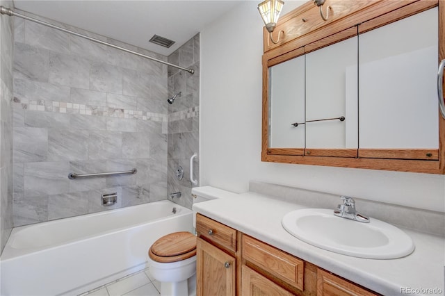 full bathroom with tiled shower / bath combo, vanity, and toilet