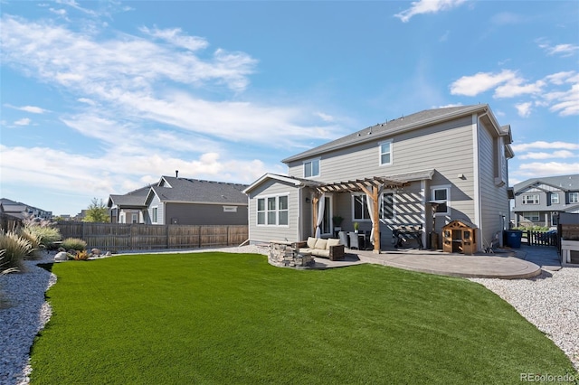 back of property with outdoor lounge area, a pergola, a patio, and a lawn