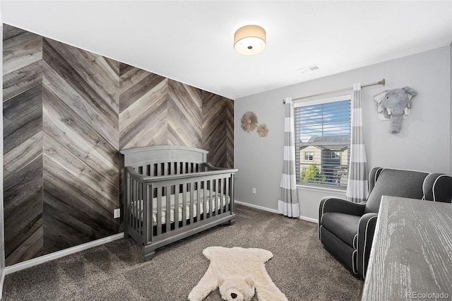 bedroom with carpet and a nursery area