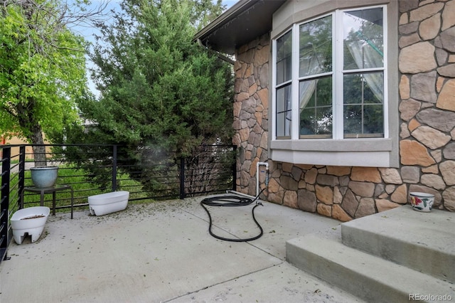 view of patio with fence