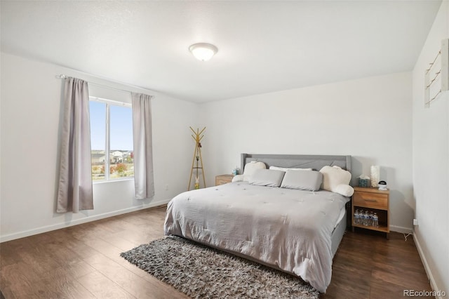 bedroom featuring dark hardwood / wood-style floors