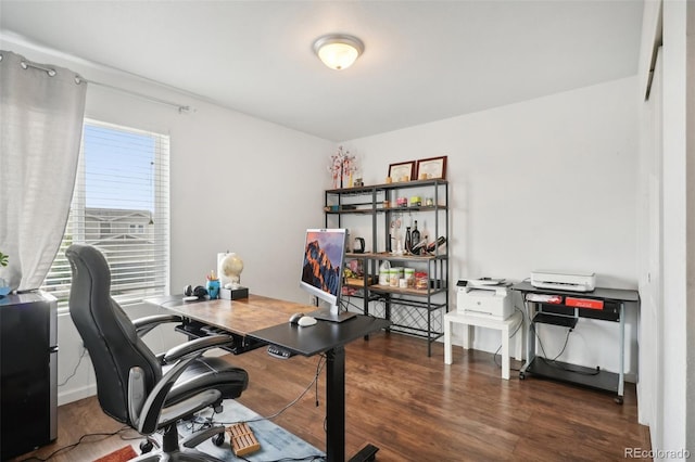 office with dark hardwood / wood-style flooring