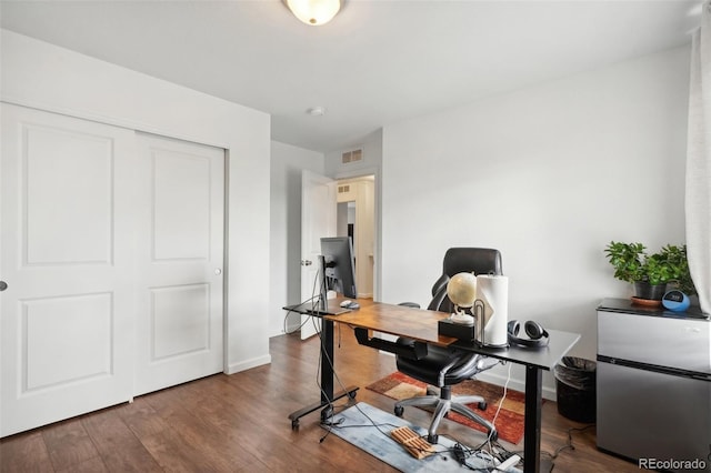 office space with wood-type flooring