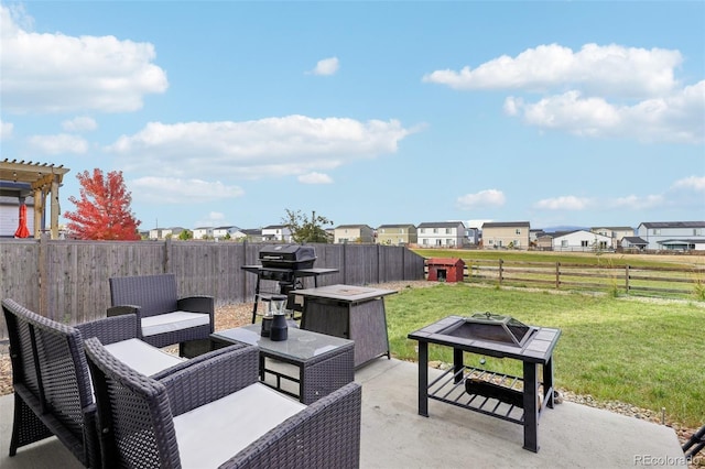 view of patio / terrace featuring area for grilling and a fire pit