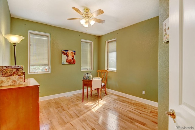 interior space with ceiling fan and light hardwood / wood-style flooring