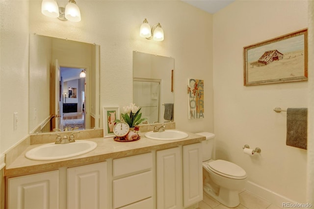 bathroom featuring vanity, walk in shower, tile patterned flooring, and toilet