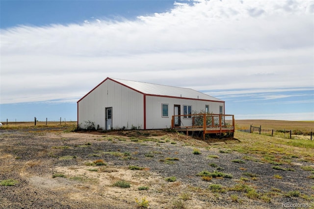 exterior space with a deck and a rural view