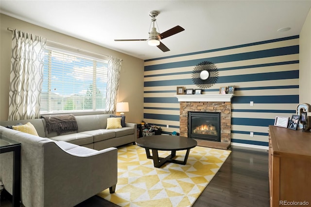 26143 E Fremont Pl, Aurora, CO 80016 - living area with wallpapered walls, ceiling fan, baseboards, a fireplace, and wood finished floors