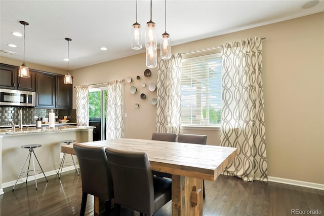 26143 E Fremont Pl, Aurora, CO 80016 - dining area featuring dark wood-style floors, baseboards, and recessed lighting
