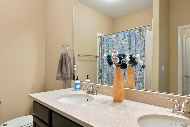 26143 E Fremont Pl, Aurora, CO 80016 - full bath with double vanity, toilet, and a shower with shower curtain