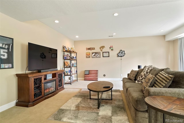 26143 E Fremont Pl, Aurora, CO 80016 - carpeted living room with recessed lighting, baseboards, and a glass covered fireplace