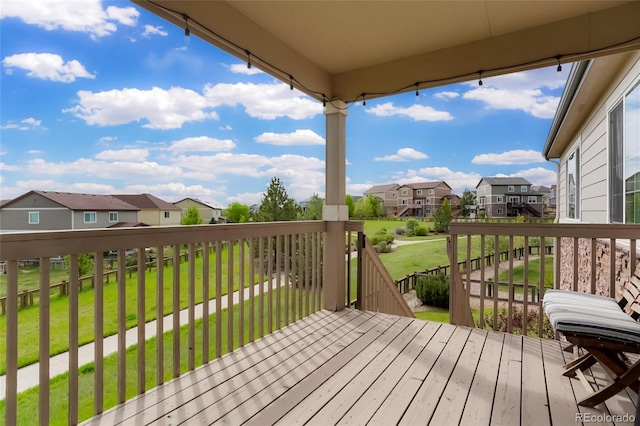 26143 E Fremont Pl, Aurora, CO 80016 - wooden terrace with a residential view and a lawn