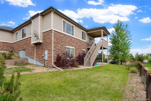 26143 E Fremont Pl, Aurora, CO 80016 - rear view of property with stone siding and stairs