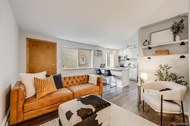 1349 Race St Unit 5, Denver, CO 80206 - living area featuring wood finished floors and a wall unit AC