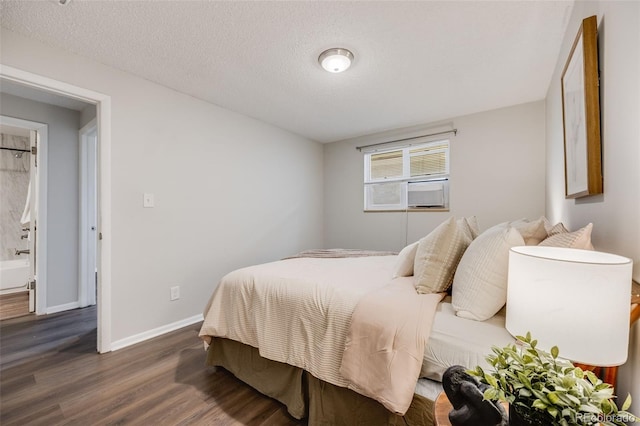 1349 Race St Unit 5, Denver, CO 80206 - bedroom with wood finished floors, baseboards, a textured ceiling, and cooling unit