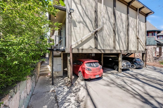1349 Race St Unit 5, Denver, CO 80206 - view of side of property with stairway and covered parking