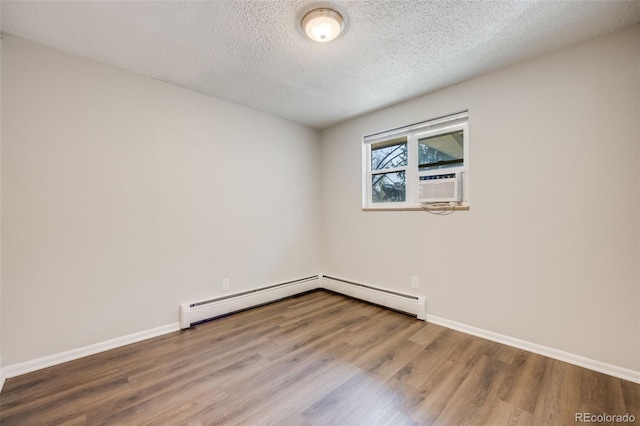 1349 Race St Unit 5, Denver, CO 80206 - unfurnished room featuring wood finished floors, a textured ceiling, and baseboards