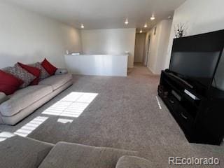 living room with carpet floors and recessed lighting