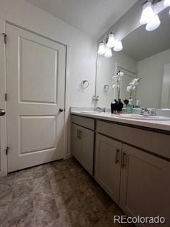 bathroom featuring double vanity and a sink