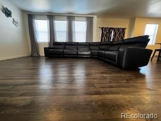 living room with a wealth of natural light and wood finished floors