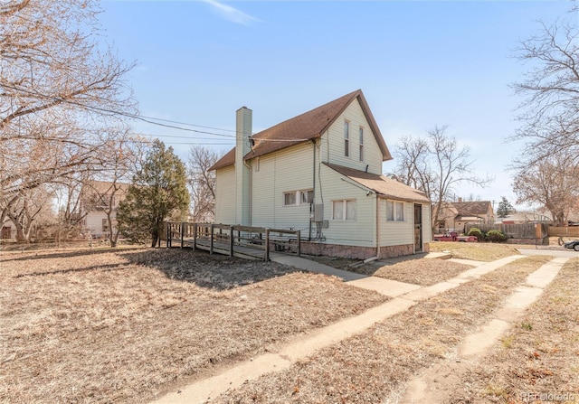 view of property exterior with a chimney