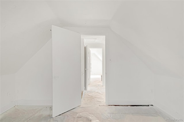 additional living space featuring vaulted ceiling