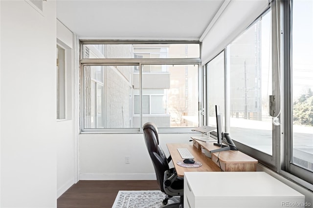 office area with baseboards and dark wood finished floors