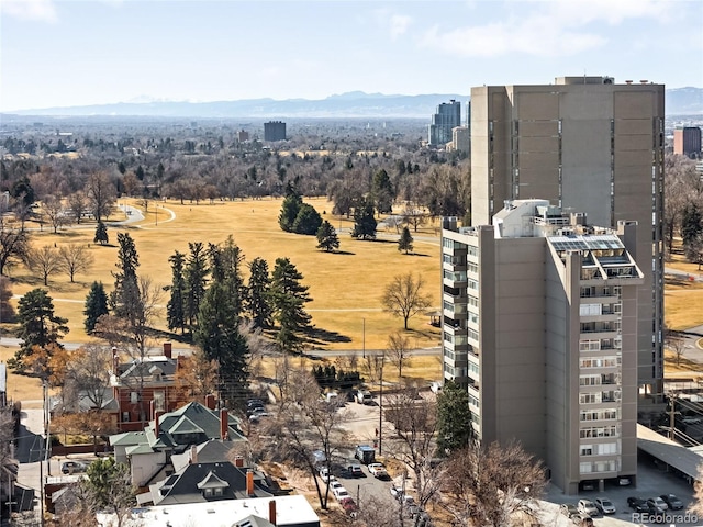 property's view of city with a mountain view