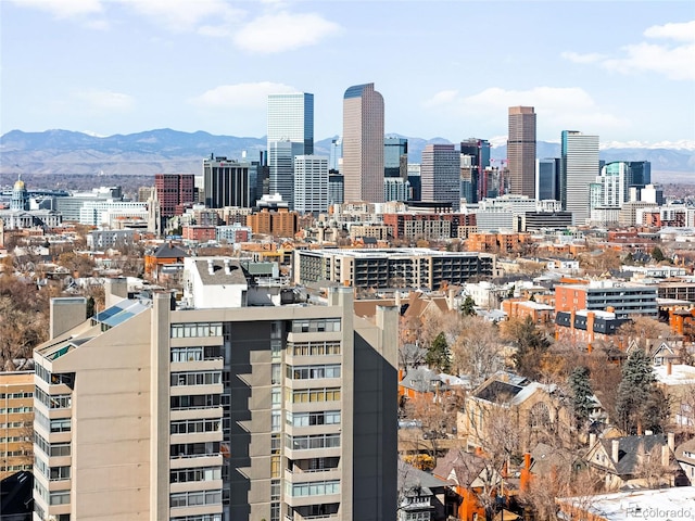 property's view of city featuring a mountain view