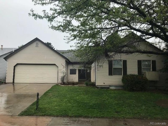 view of front of house featuring a garage and a front yard