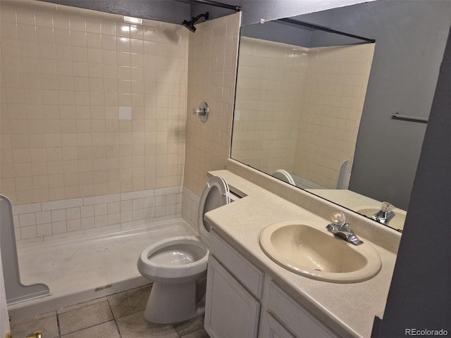 16094 E Exposition Dr, Aurora, CO 80017 - full bath with tile patterned floors, tiled shower, toilet, and vanity