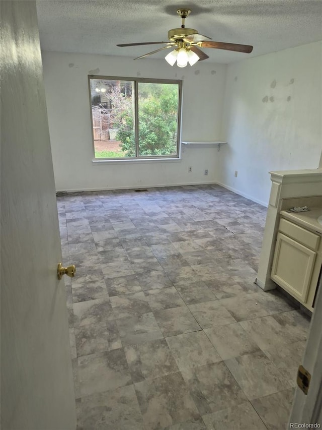 16094 E Exposition Dr, Aurora, CO 80017 - unfurnished room featuring a textured ceiling and ceiling fan