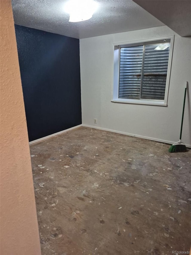 16094 E Exposition Dr, Aurora, CO 80017 - spare room with a textured ceiling and baseboards