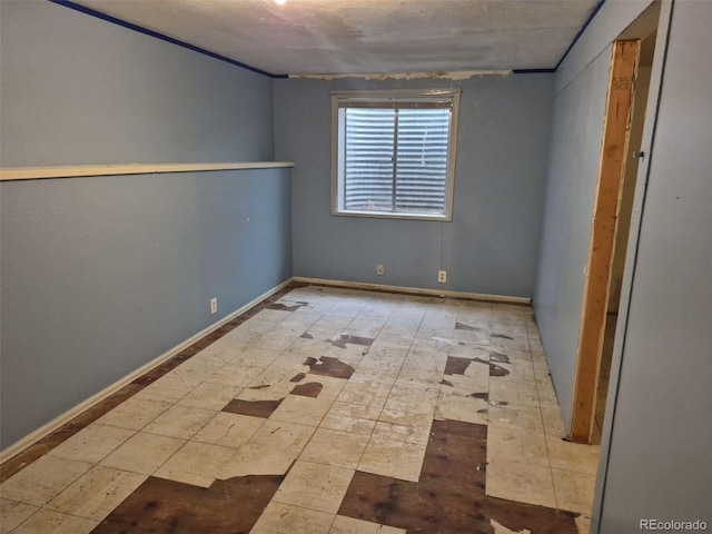 16094 E Exposition Dr, Aurora, CO 80017 - unfurnished room featuring baseboards