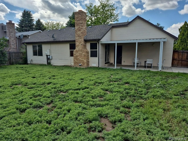 16094 E Exposition Dr, Aurora, CO 80017 - rear view of property with a patio and a chimney