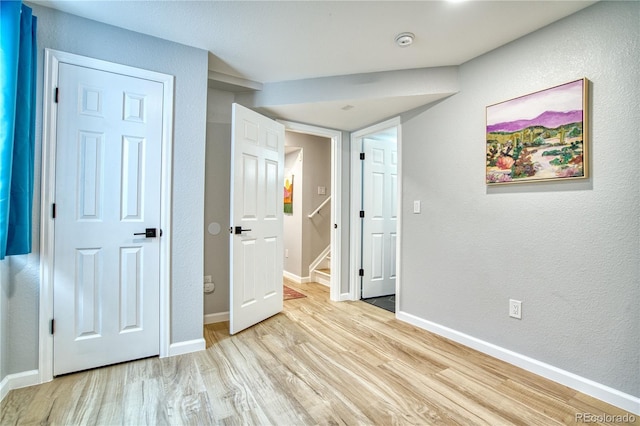 5532 S Valdai Way, Aurora, CO 80015 - unfurnished bedroom with wood finished floors, baseboards, and a textured wall