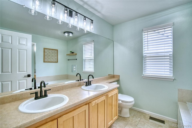 5532 S Valdai Way, Aurora, CO 80015 - full bathroom with a bath, tile patterned floors, toilet, double vanity, and baseboards