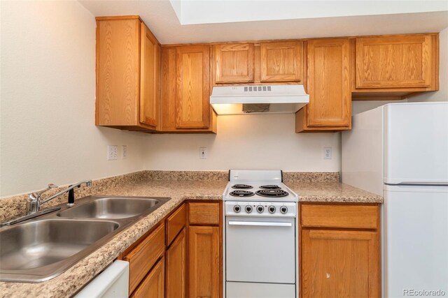 kitchen with white appliances, sink, and custom range hood