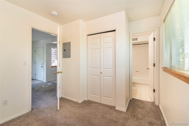 2850 Aurora Ave Unit 112, Boulder, CO 80303 - unfurnished bedroom with carpet flooring, electric panel, a closet, and baseboards